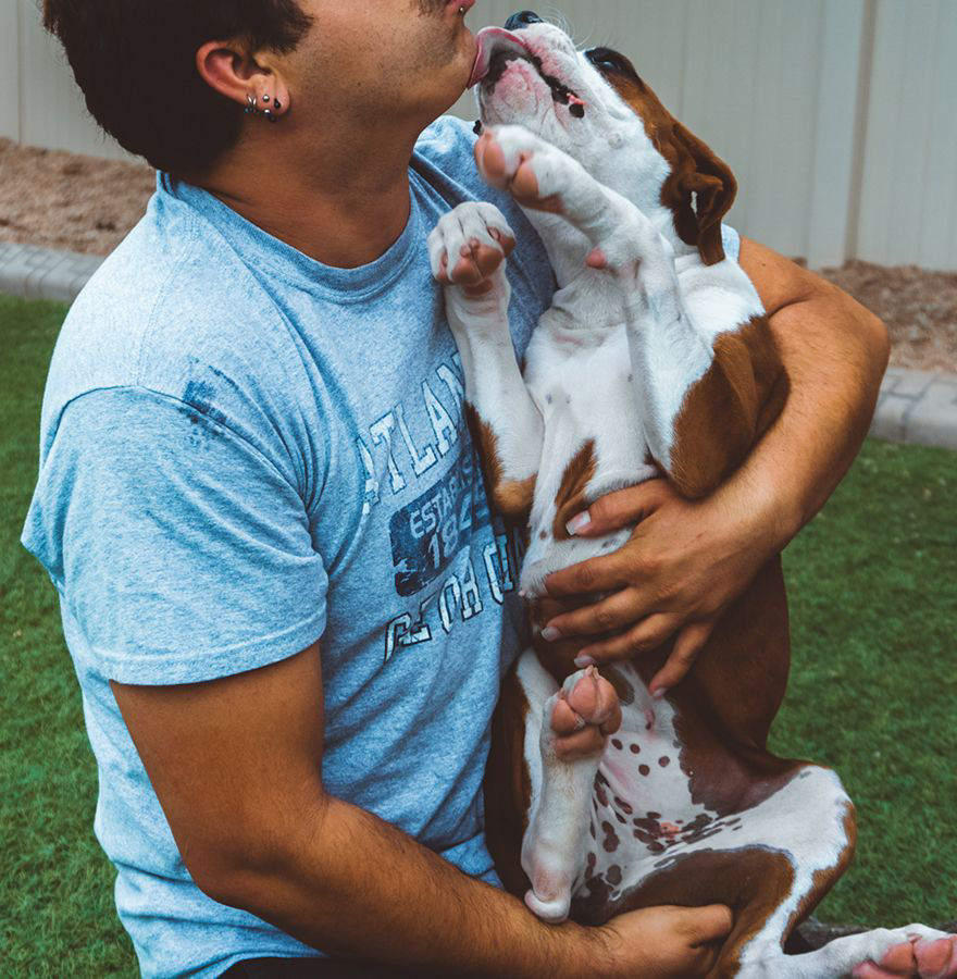 Dog and man cuddling