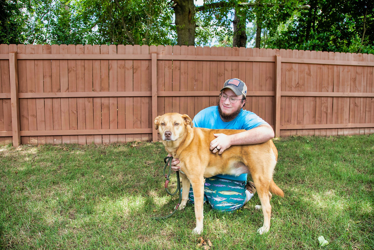 employee taking care of dog