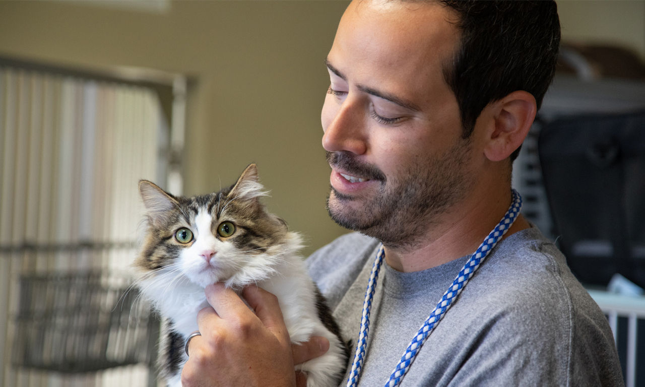 man with cat