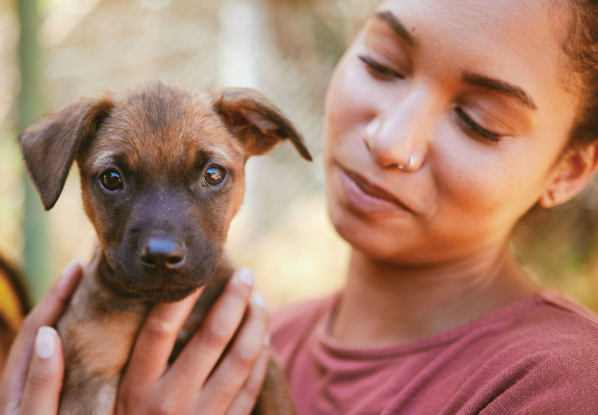 Women looking at her puppy