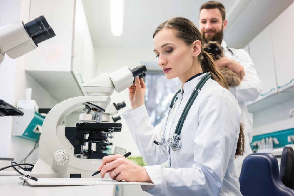 Woman looking through microscope